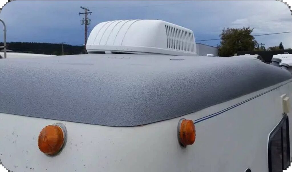 A spray polyurea cap flows around lights and curves with no seams.